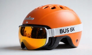 A modern ski helmet with ventilation and goggle compatibility, emphasizing safety and design.