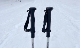 A pair of lightweight ski poles, showing ergonomic grips and baskets, ready for action.